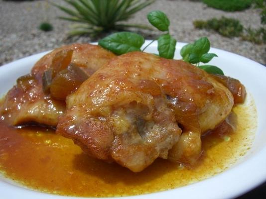 cuisses de poulet dans une marinade à la mangue et au curry